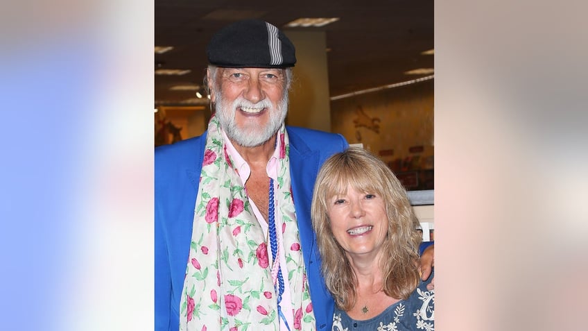 Jenny Boyd smiling alongside her ex-husband Mick Fleetwood