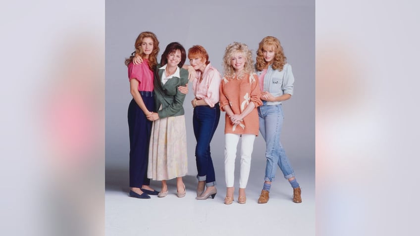 Julia Roberts, Sally Field, Shirley MacClaine, Dolly Parton, and Daryl Hannah pose for a photo from "Steel Magnolias"