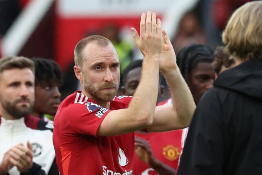 Manchester United midfielder Christian Eriksen applauds supporters after playing his final