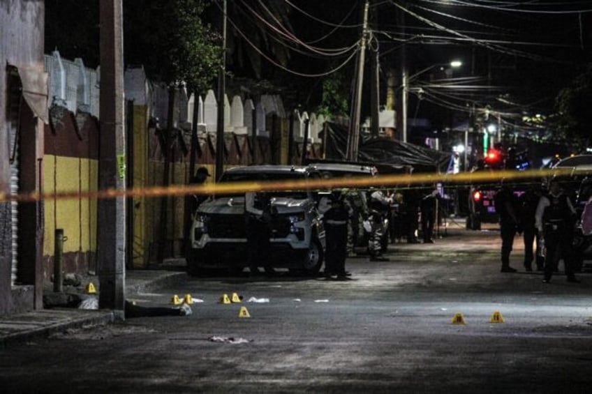 The body of Gisela Gaytan, candidate for mayor of the Mexican city of Celaya, lies on a st