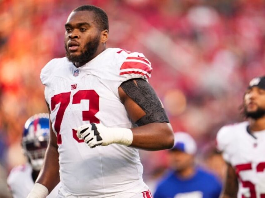 espn radio host goes ballistic calls giants tackle evan neal human trash for criticizing fans