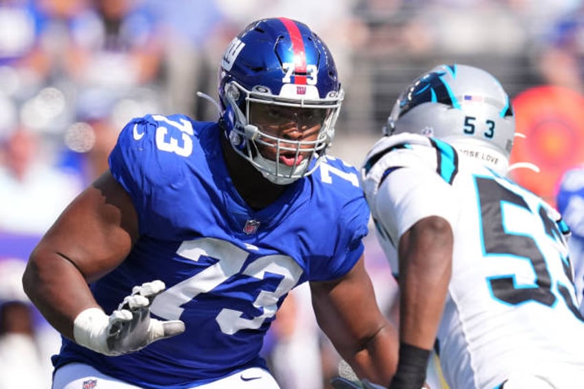 espn radio host goes ballistic calls giants tackle evan neal human trash for criticizing fans