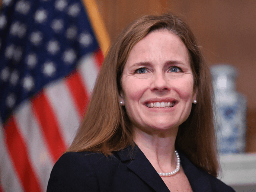 Judge Amy Coney Barrett, President Donald Trumps nominee for the U.S. Supreme Court, is shown while meeting with Sen. Mitt Romney, R-Utah, on Capitol Hill in Washington, Wednesday, Sept. 30, 2020. (Erin Scott/Pool via AP)