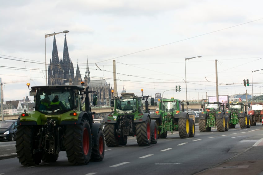 Hundreds of farmers from nearby communities are kicking off a week-long strike to protest against the government's plan to cut agricultural subsidies and are blocking roads in Cologne, Germany, on January 8, 2024. (Photo by Ying Tang/NurPhoto via Getty Images)