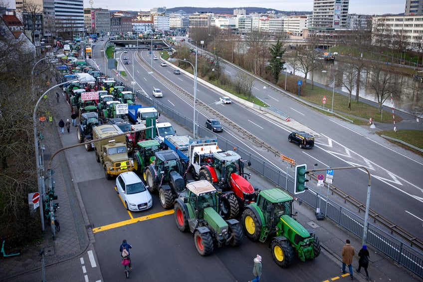 08 January 2024, Saarland, Saarbrücken: Tractors stand on a road on the fringes of the farmers' protests. In response to the federal government's austerity plans, the farmers' association has called for a week of action with rallies and rallies starting on January 8. It is to culminate in a major demonstration in the capital on January 15. Photo: Laszlo Pinter/dpa (Photo by Laszlo Pinter/picture alliance via Getty Images)