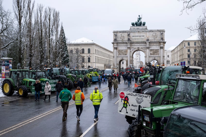 08 January 2024, Bavaria, Munich: Tractors stand during a demonstration by farmers in the city center. In response to the federal government's austerity plans, the farmers' association has called for a week of action with rallies and rallies starting on January 8. It is to culminate in a major demonstration in the capital on January 15. Photo: Lennart Preiss/dpa (Photo by Lennart Preiss/picture alliance via Getty Images)