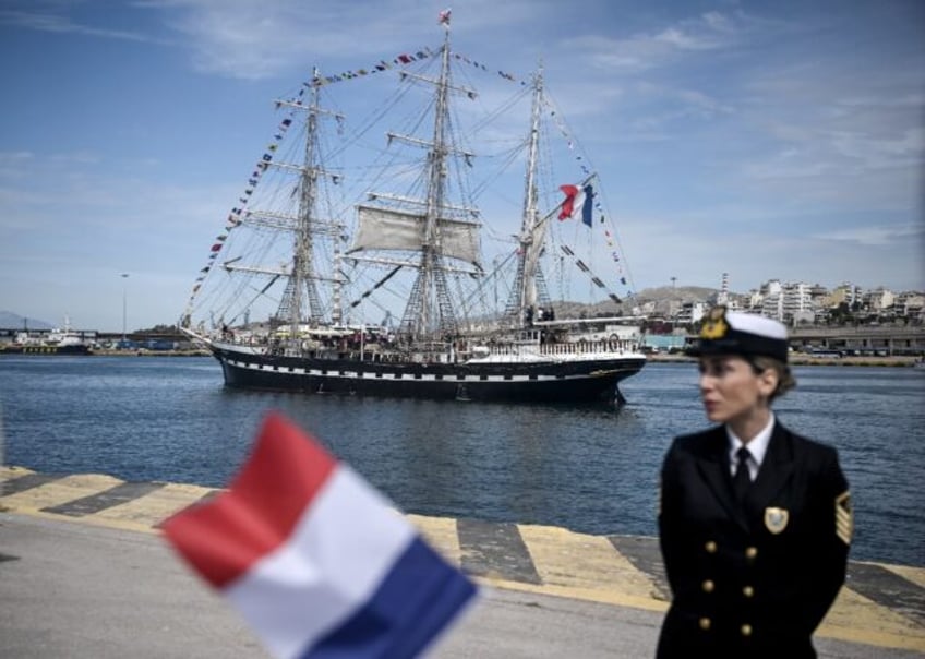 The Olympic torch begins its sea journey to France on the Belem from Piraeus