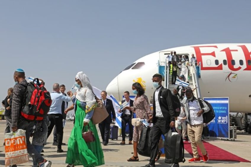 Ethiopian Jewish immigrants arrive in Israel on an aircraft chartered by the Jewish Agency