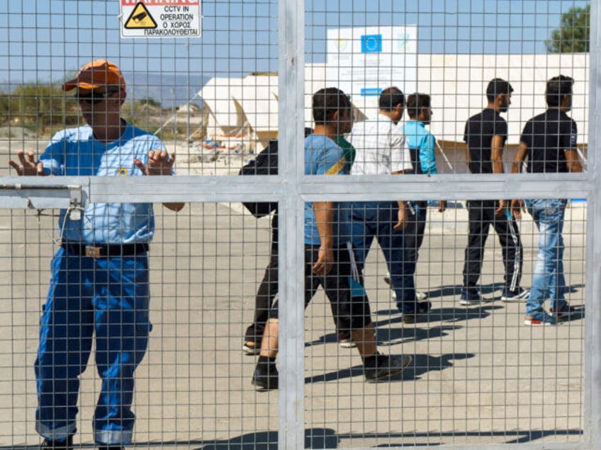 Syrian migrants arrive at the Kokkinotrimithia refugee camp, west of the Cypriot capital N