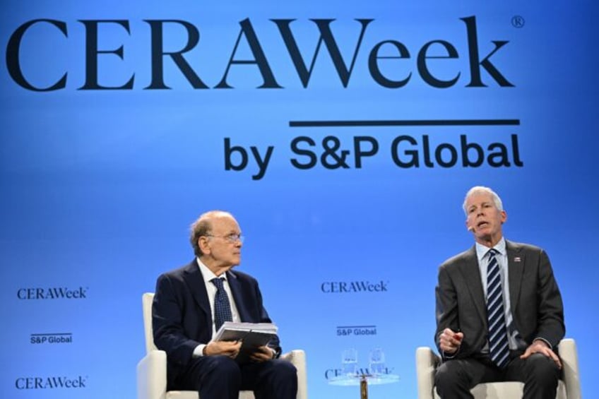 US Energy Secretary Chris Wright (R) speaks with the vice-chairman of S&P Global Danie