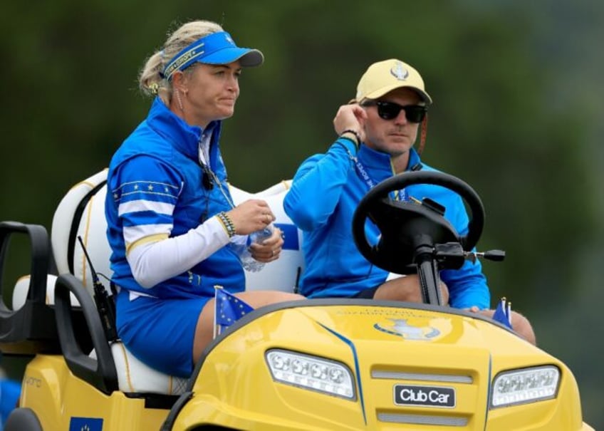 European captain Suzann Pettersen of Norway, left, watches from a golf cart during the fir