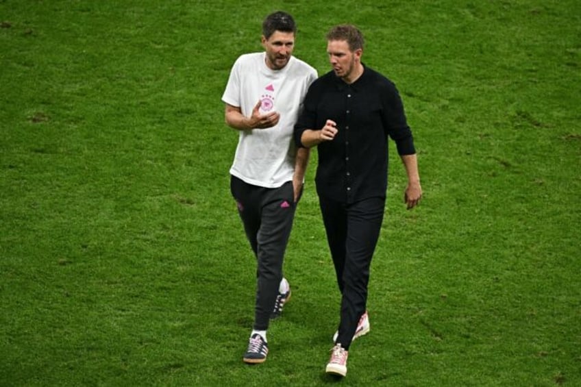 Germany coach Julian Nagelsmann talking to assistant manager Sandro Wagner