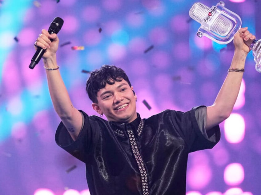 Winner of the Eurovision Song Contest JJ from Austria holds up the trophy onstage, he won