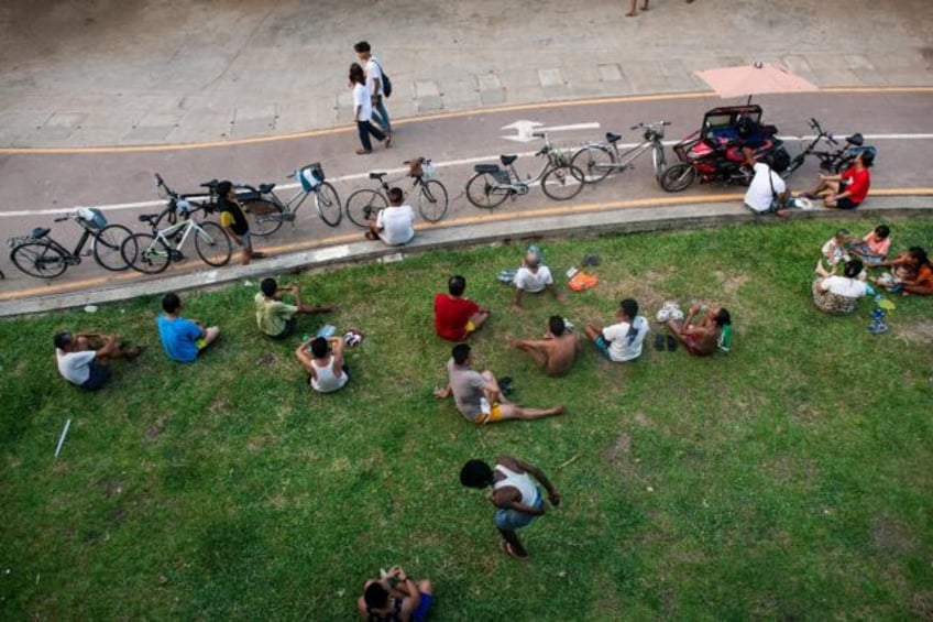 Yangon's parks offer some relief from scorching temperatures during daily electricity blac