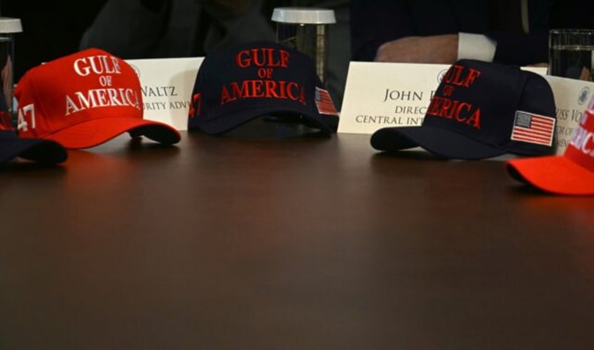 Gulf of America hats are set on a table as US President Donald Trump holds a meeting with