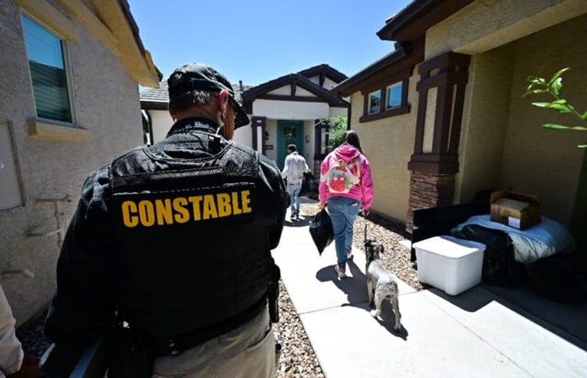 Lennie McCloskey, Constable of Manistee Justice Precint in Maricopa County watches as a fa