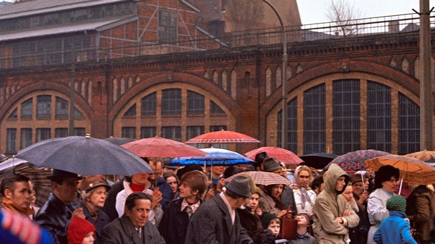 ex agent of communist east germanys secret police charged with murdering polish man in 1974 at berlin wall