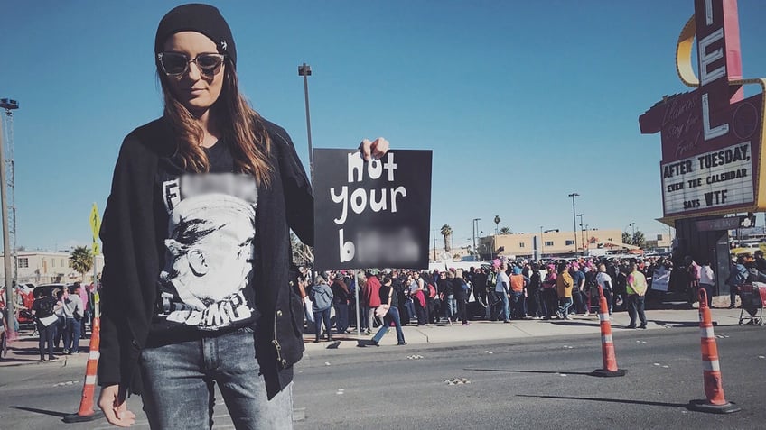 Stepfanie Tyler holds sign at women's march