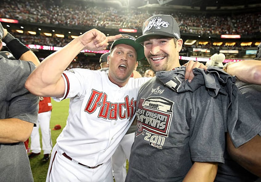 Sean Burroughs and Xavier Nady of the Arizona Diamondbacks celebrate after defeating the San Francisco Giants and clinching the National League West...