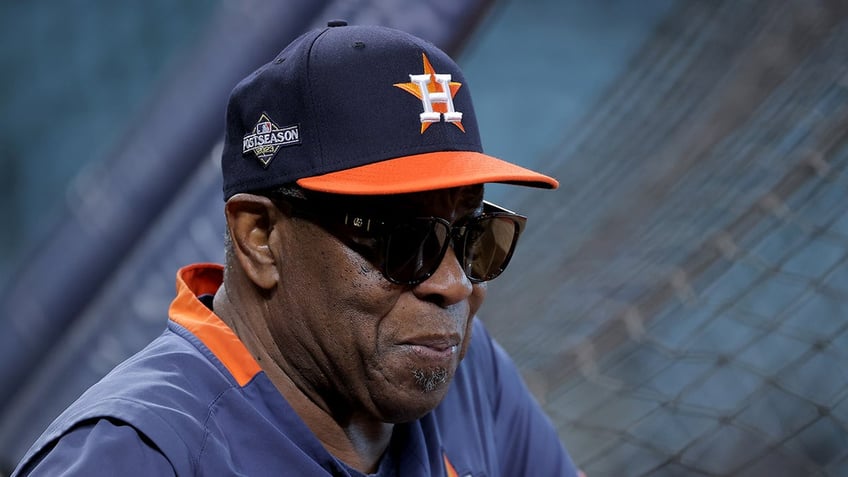 Dusty Baker looks on