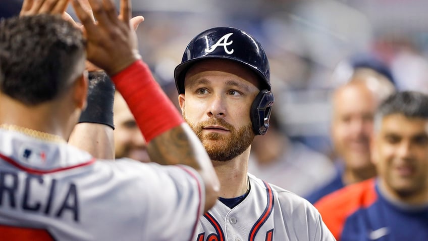 Jonathan Lucroy high-fives teammate