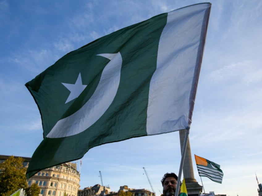 LONDON, UNITED KINGDOM - 2019/10/27: A Kashmir supporter waving a flag of Pakistan during