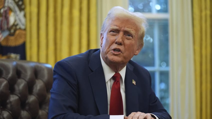 Donald Trump at desk in Oval Office closeup shot