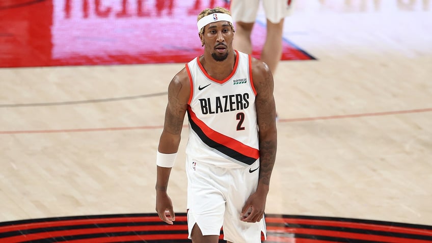 Rondae Hollis-Jefferson looks on during a game