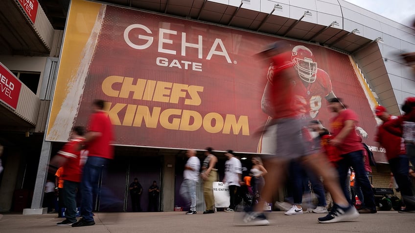 Chiefs fans walk into the stadium