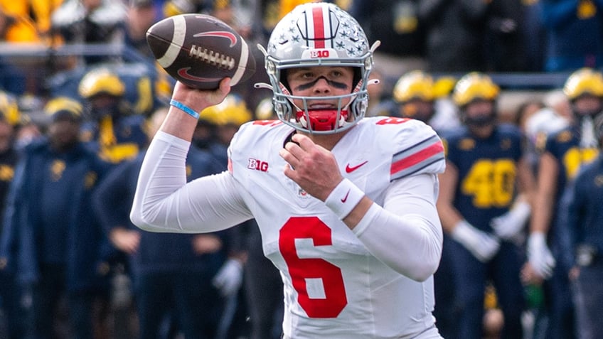 Kyle McCord looks to throw