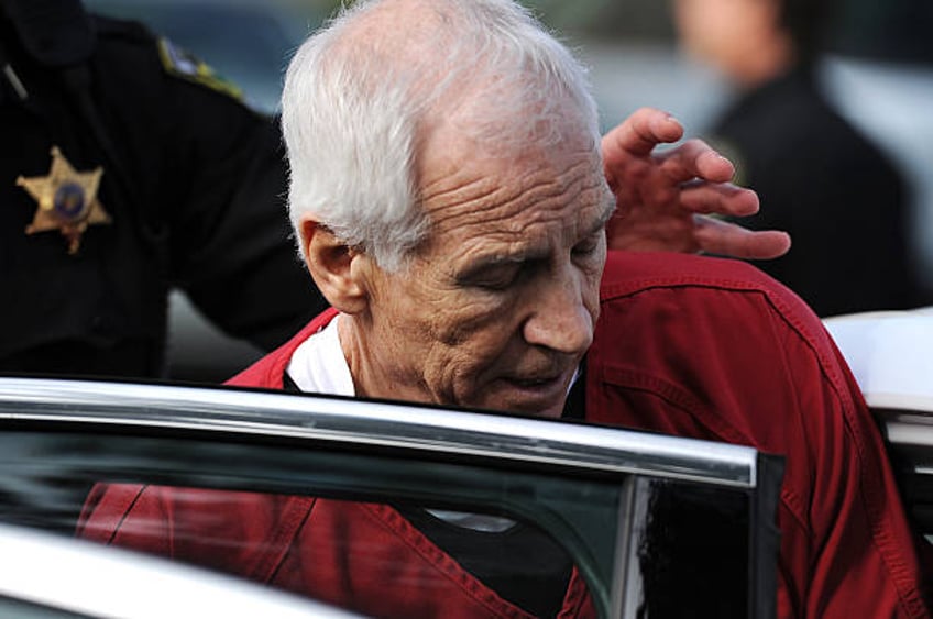 Former Penn State assistant football coach Jerry Sandusky leaves the Centre County Courthouse after being sentenced in his child sex abuse case on...