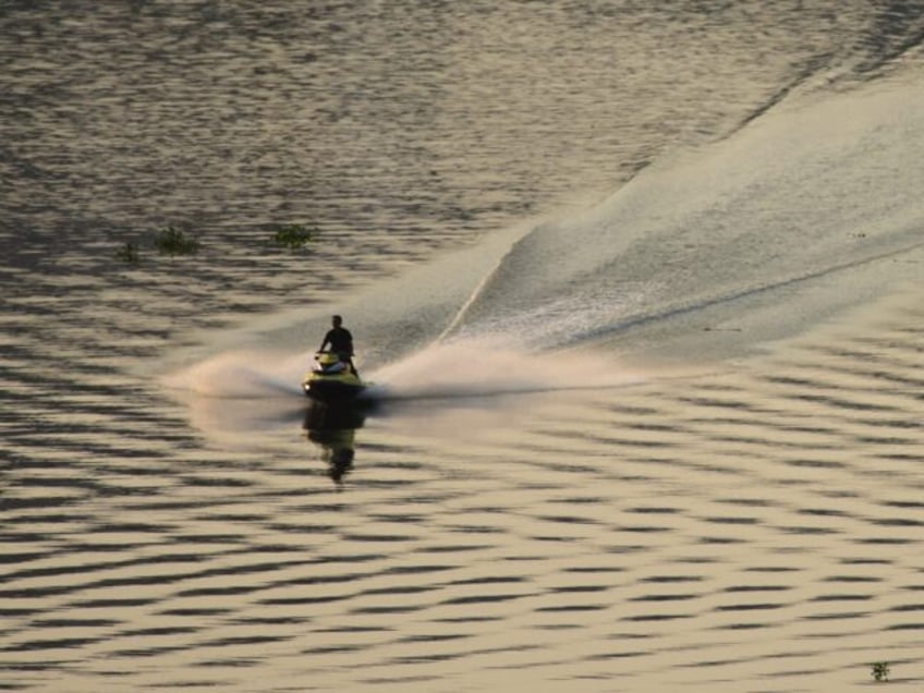 ex political prisoner flees china for freedom on a jet ski