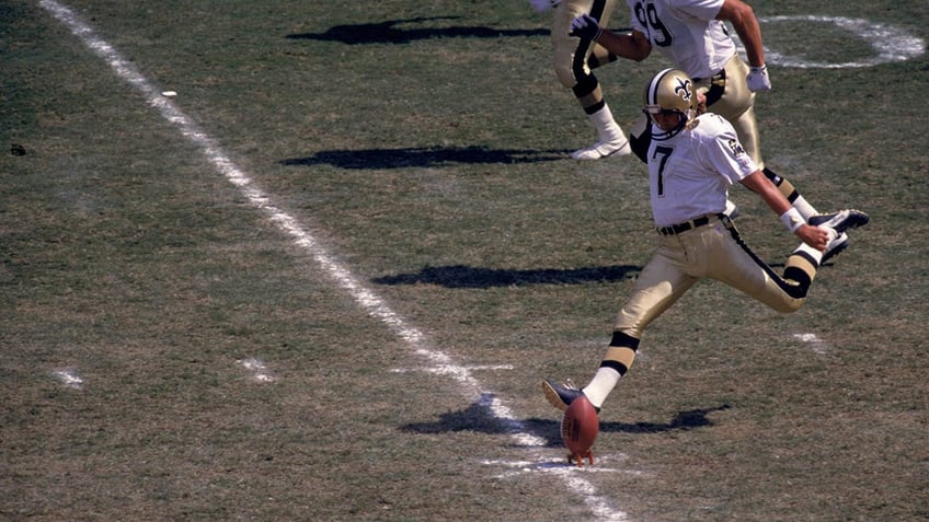 Morten Andersen kicks off during a game