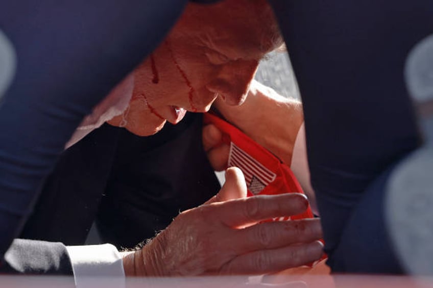 Secret Service tend to republican presidential candidate former President Donald Trump onstage at a rally on July 13, 2024 in Butler, Pennsylvania....