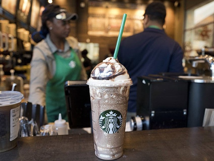 A Venti Mocha Frappuccino is displayed at a Starbucks, Wednesday, June 20, 2018, in New York. The 24 fluid ounces drink has 520 calories, according to Starbucks. Starbucks says sales for its frozen coffee drink are down, and is blaming concerns about sugar and calories. (AP Photo/Mark Lennihan)