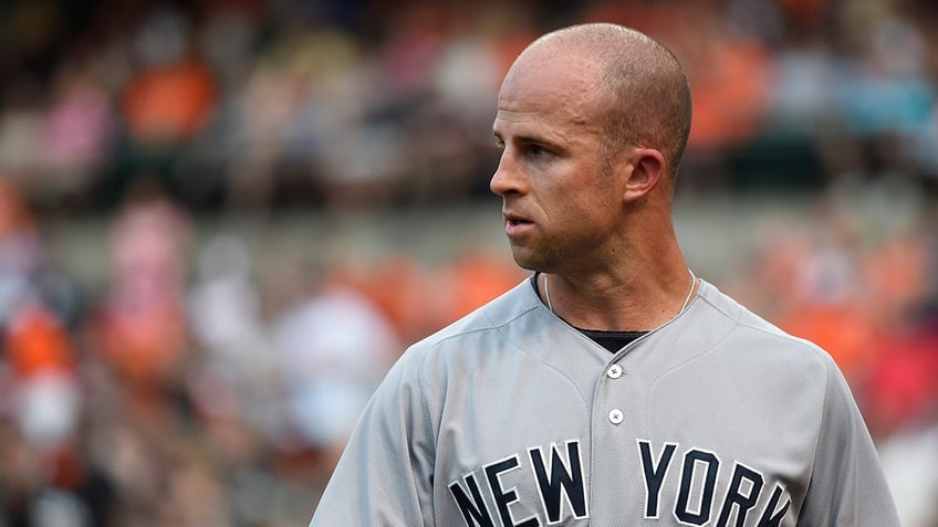 Brett Gardner looks on