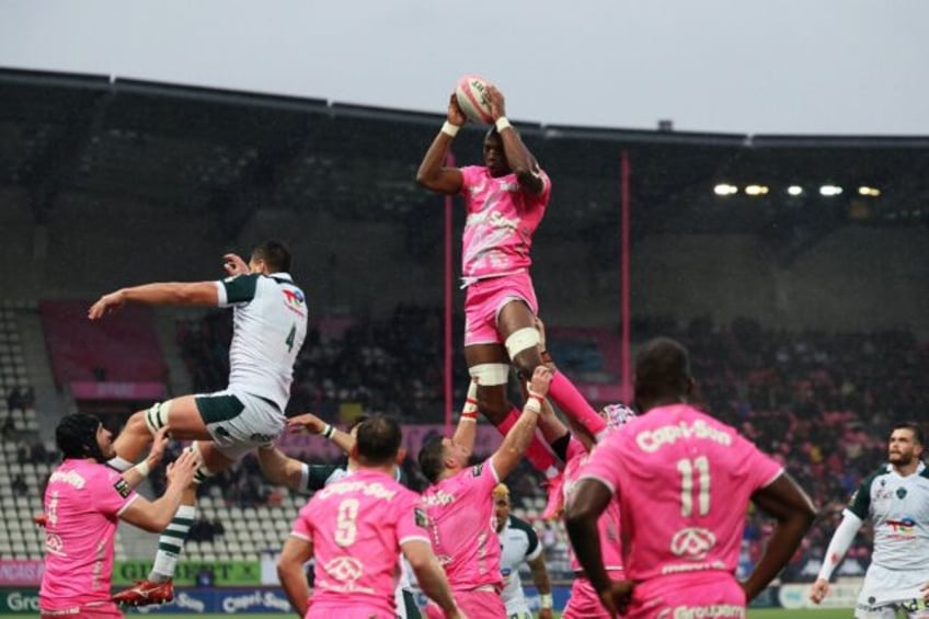 Stade Francais' Sekou Macalou (C) catches a lineout during the Pau win