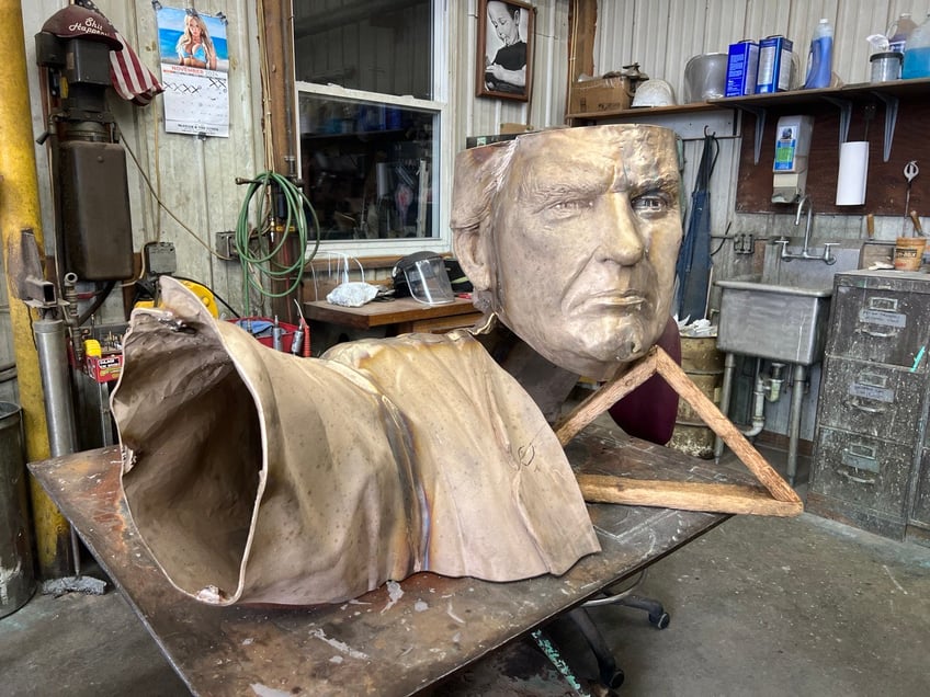 exclusive a two story trump statue drawing on his iconic defiance post assassination attempt is under construction