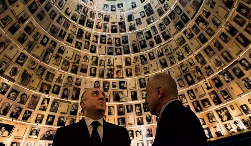 Azerbaijan's Foreign Minister Elmar Mammadyarov, left, visits the Hall of Names at the Yad Vashem Holocaust memorial in Jerusalem, Monday, April 22, 2013. Israel's president on Monday praised Azerbaijan for playing a key role in countering Iran's influence in the Middle East as the Muslim country's foreign minister visited the Jewish state for the first time. (AP Photo/Bernat Armangue)