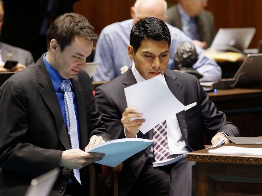 FILE - In this Tuesday, May 3, 2016 file photo, Rep. J.D. Mesnard, left, R-Chandler, talks