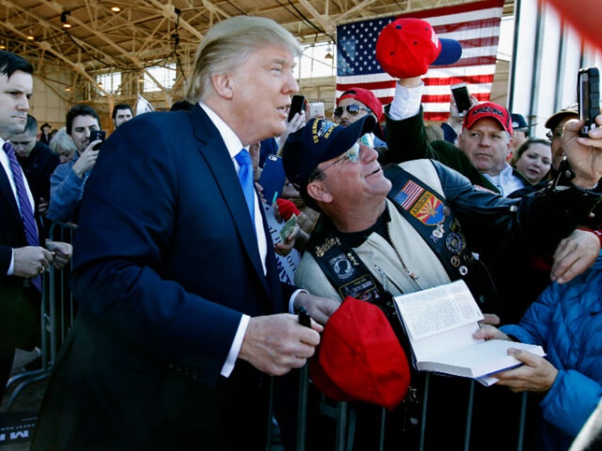 MESA, AZ - DECEMBER 16: Republican presidential candidate Donald Trump poses for a picture