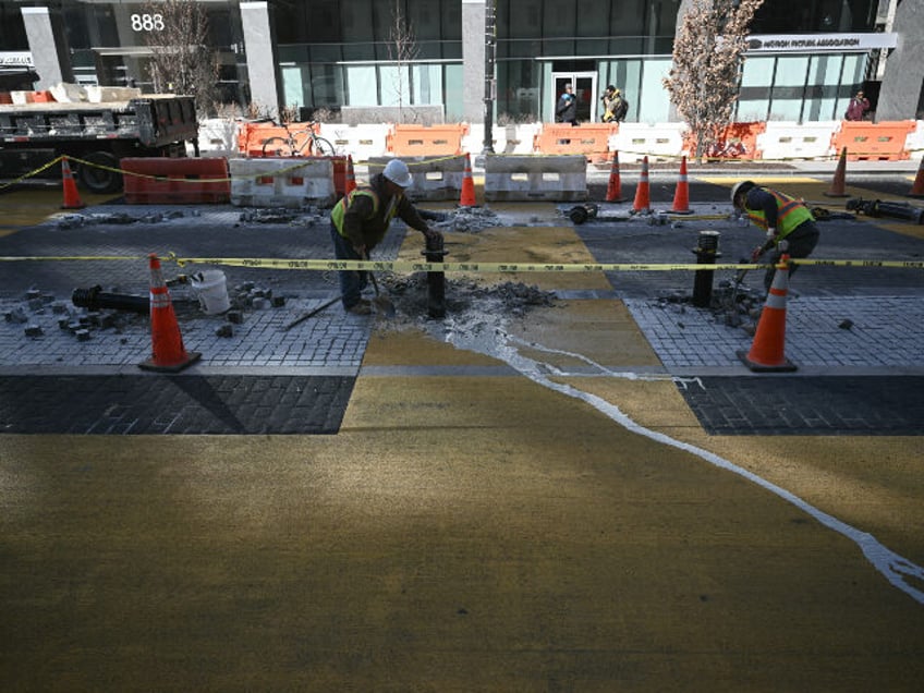 Crews begin work to remove the "Black Lives Matter" street mural and plaza in Wa