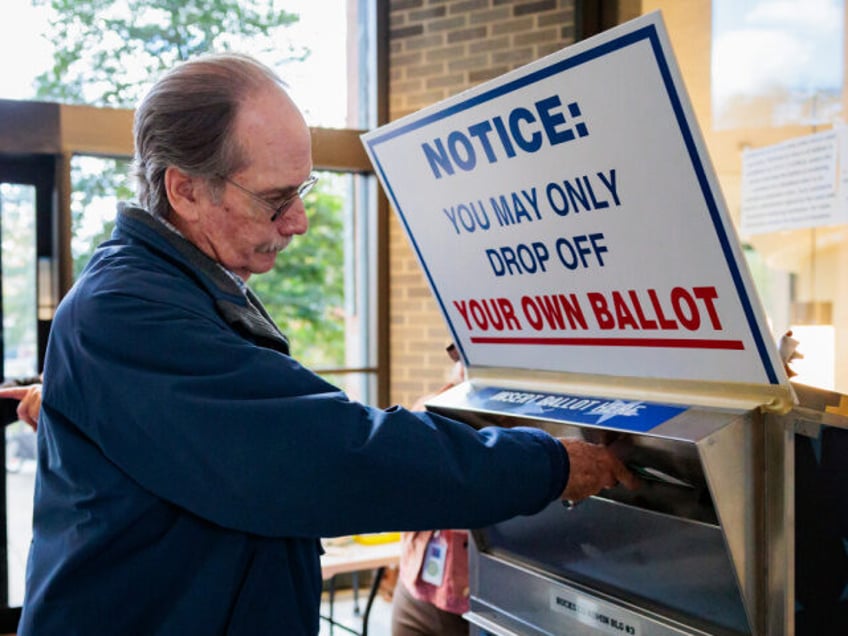 Bill Nicholson drops off a mail-in ballot on October 15, 2024 in Doylestown, Pennsylvania.