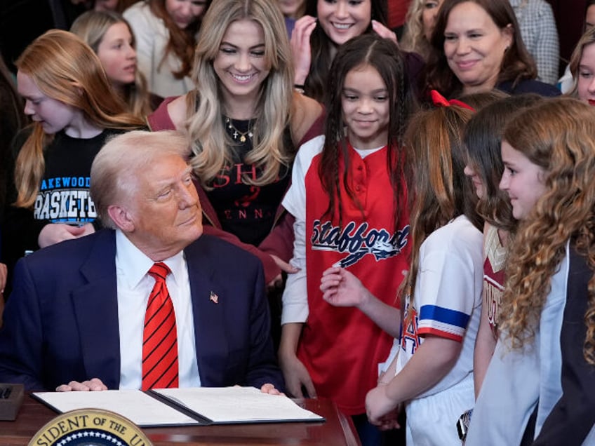 President Donald Trump signs an executive order barring [male] athletes from competing in