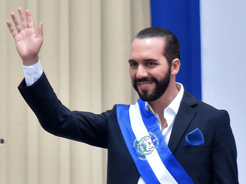 Salvador's new president, Nayib Bukele, waves during his inauguration ceremony at Gerardo