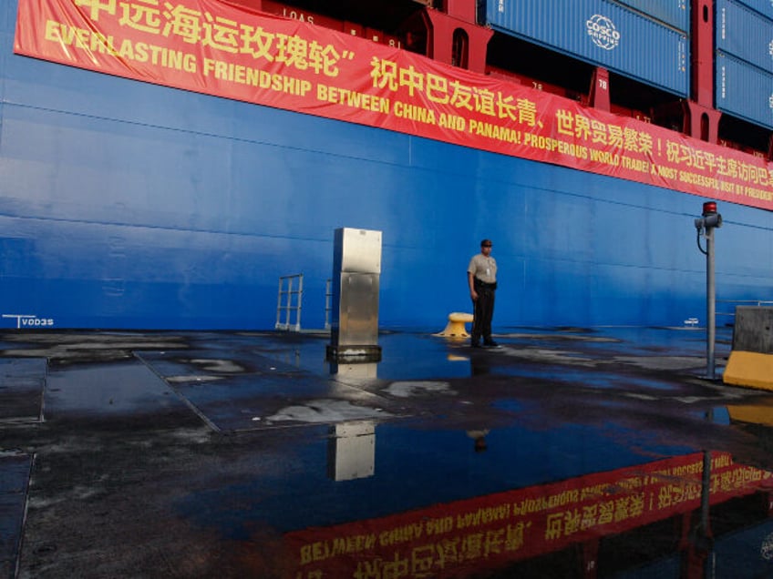 In this Dec. 3, 2018, photo, a Panama Canal guard stands at attention in front of a Chines