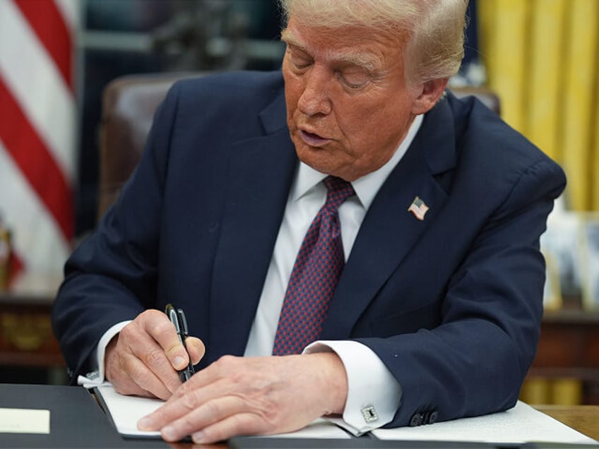 FILE - President Donald Trump signs an executive order on birthright citizenship in the Ov