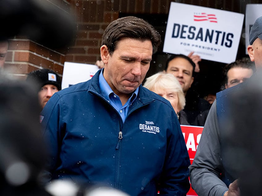 Republican presidential candidate Florida Gov. Ron DeSantis and Rep. Chip Roy, R-Texas, speak to members of the media outside his campaign office in Urbandale, Iowa, Friday, Jan. 12, 2024. (AP Photo/Andrew Harnik)