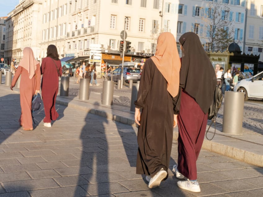 MARSEILLE, FRANCE - AUGUST 31 : Women in burkas walk along the old port on August 31, 2023