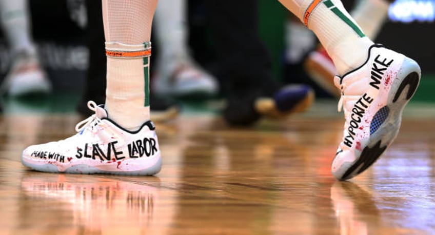 The sneakers worn by the Celtics Enes Kanter had a message for Nike: MADE WITH SLAVE LABOR HYPOCRITE NIKE. The Boston Celtics hosted the Washington...